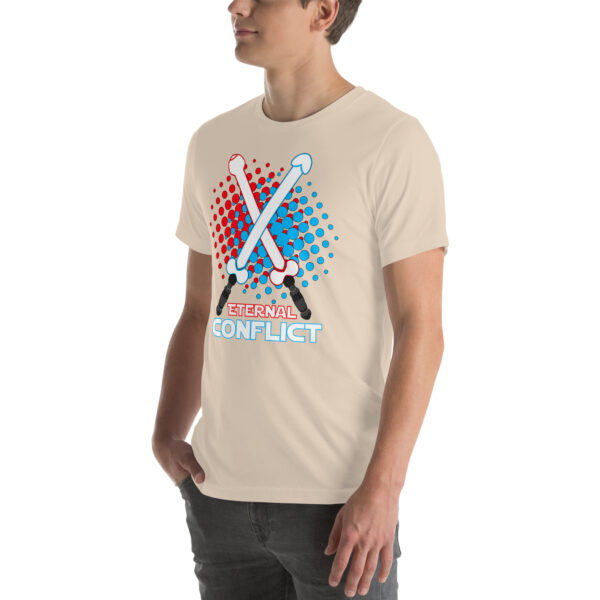 A person wearing the Eternal Conflict beige t-shirt, featuring a graphic of two crossed swords with "Eternal Conflict" written in red and blue.