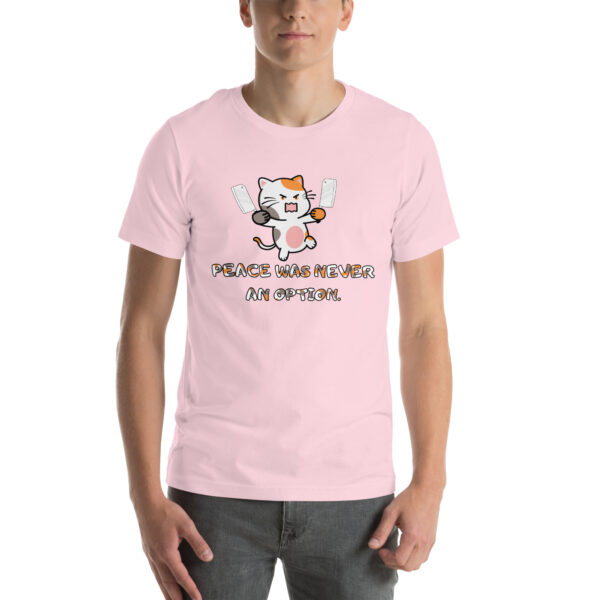 A person wears the "Peace Was Never An Option" light pink T-shirt, which features an illustrated cat holding two knives with the text "Peace was never an option.