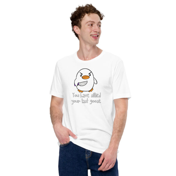 A person wears the "You Have Sillied Your Last Goose" t-shirt, which is white and features a cartoon penguin with playful text.