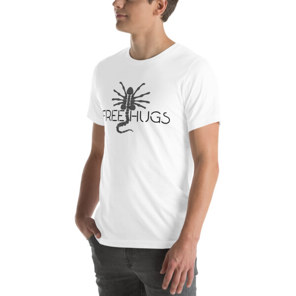 Person wearing a white t-shirt featuring a black scorpion graphic alongside the product name "Free Hugs.