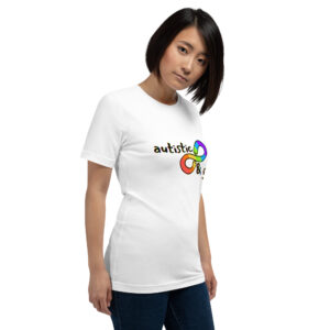 Person wearing the "Autistic & Gay" T-shirt, featuring a colorful infinity symbol and the words "autistic &" printed on it.