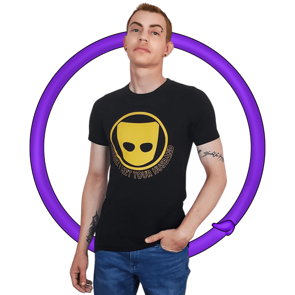 Person posing with one hand in pocket, wearing a black t-shirt with a yellow graphic and message, against a transparent background with purple circle.