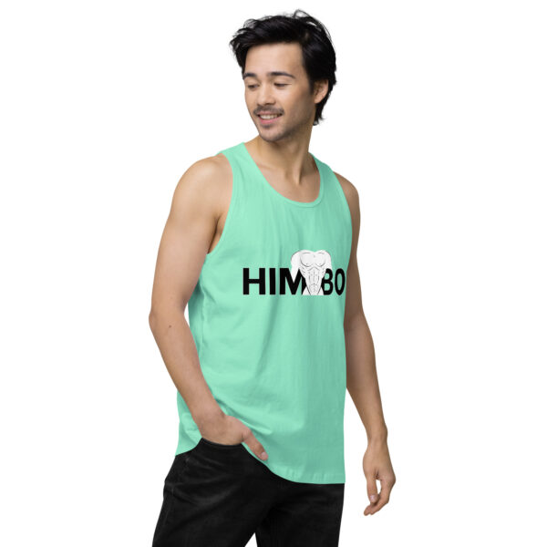 Person wearing the Himbo Tank, a light green top with "HIMBO" and an elephant graphic, glancing to the side.