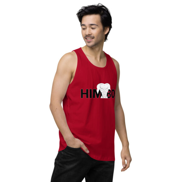 A person stands with one hand in their pocket wearing the Himbo Tank, featuring a red color with "HIMBO" and a white elephant graphic.