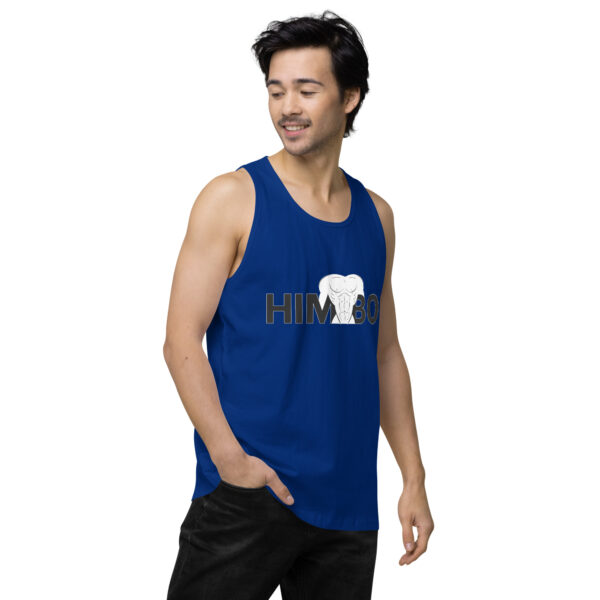 Person in a blue Himbo Tank featuring an elephant graphic, standing casually with one hand in their pocket.