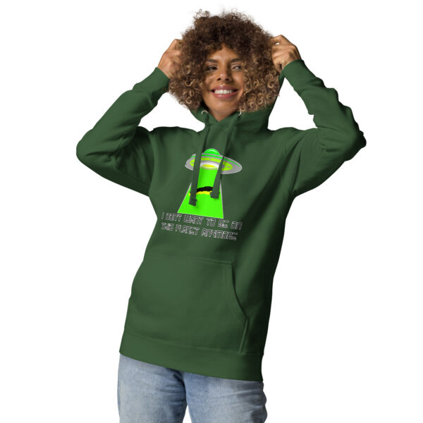 Person wearing the "I Don't Want to Be on This Planet Anymore" hoodie, which features a UFO graphic and text, smiling while holding their curly hair.