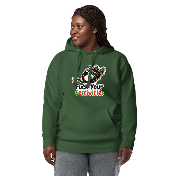 A person wearing the "Fuck Your Festivities" hoodie, featuring a festive cat graphic and text, paired with gray pants, stands against a white background.