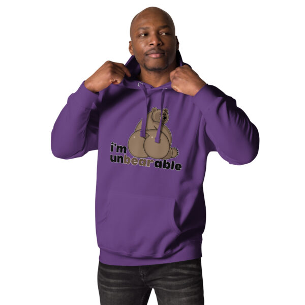 A person wearing the "I'm Unbearable" hoodie, featuring a cartoon bear and text, is adjusting the hood.