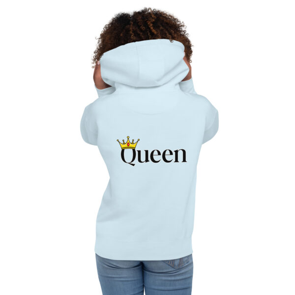 Someone dressed in a light blue Queen Hoodie featuring the word "Queen" and a crown graphic on the back.