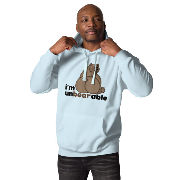 Person wearing the "i'm unbearable" light blue hoodie featuring a bear graphic and text.