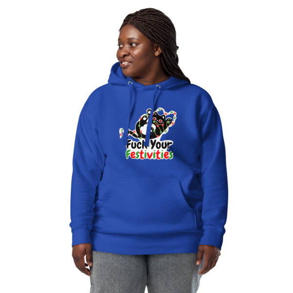 A person wearing the "Fuck Your Festivities" blue hoodie with a festive design and text stands against a white background.