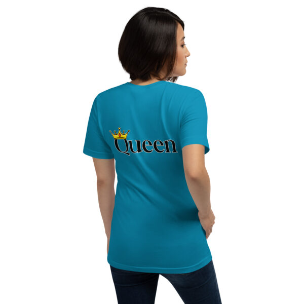 A woman wearing a blue "Queen" T-shirt featuring a crown graphic on the back, standing sideways.