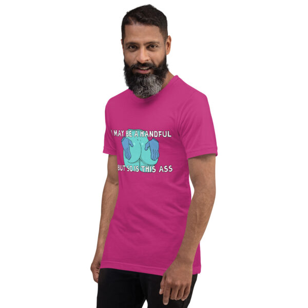 Person wearing the "A Handful" pink T-shirt, featuring text and graphics.