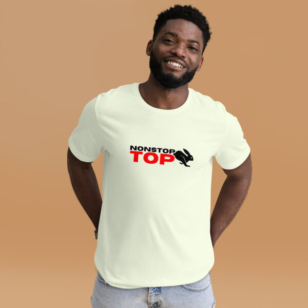 A smiling man wears the Nonstop Top T-shirt in light green, featuring "NONSTOP TOP" and a running rabbit graphic against a plain beige backdrop.