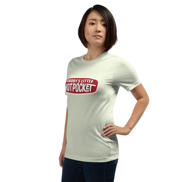 A person is standing in a neutral pose against a plain background, wearing a t-shirt in light gray featuring the text "Daddy's Little Hotpocket" in red and white.