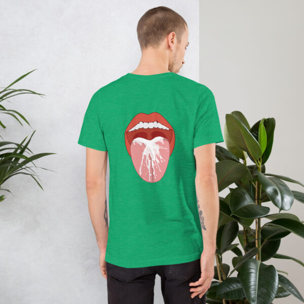 A person wearing the "Thirsty" green T-shirt with an open mouth and dolphin graphic on the back, standing near a potted plant.