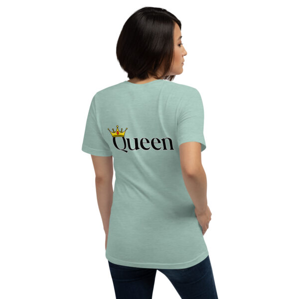 A woman wearing the "Queen" light green t-shirt, featuring a crown graphic on the back, stands against a white background.