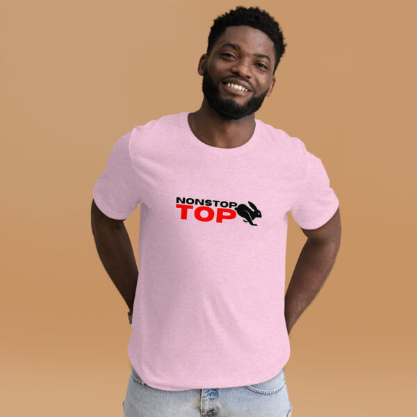 Man smiling, wearing the Nonstop Top light pink T-shirt with "NONSTOP TOP" text in black and red, featuring a small bunny graphic. The background is solid beige.