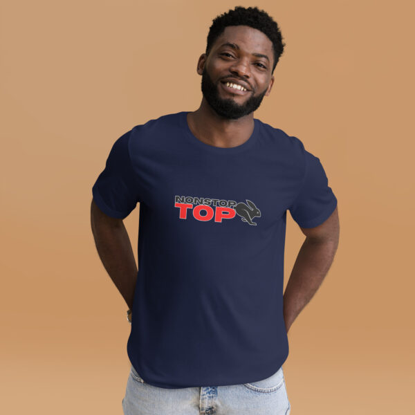 A man wears the Nonstop Top, a navy blue shirt with "NONSTOP TOP" in red text, smiles with one hand on his hip against a beige background.