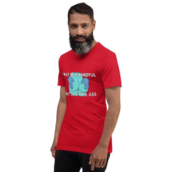 A man with a beard wears a red T-shirt featuring the humorous "A Handful" graphic and text.