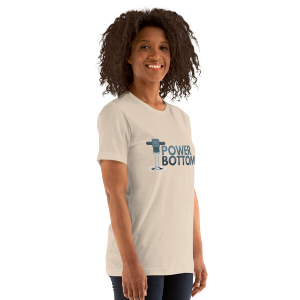 A person wearing the "Power Bottom" t-shirt smiles against a plain background.