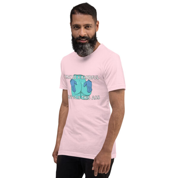 A bearded man wearing a pink T-shirt featuring a graphic and the text, "I May Be 'A Handful' But So Is This Ass.