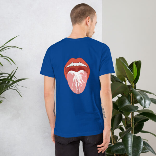 Man with short hair wearing the 'Thirsty' blue t-shirt, which features a graphic of an open mouth with a bird on the tongue, standing near a wall and green plant.